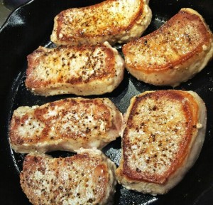 pan full of seared pork chops